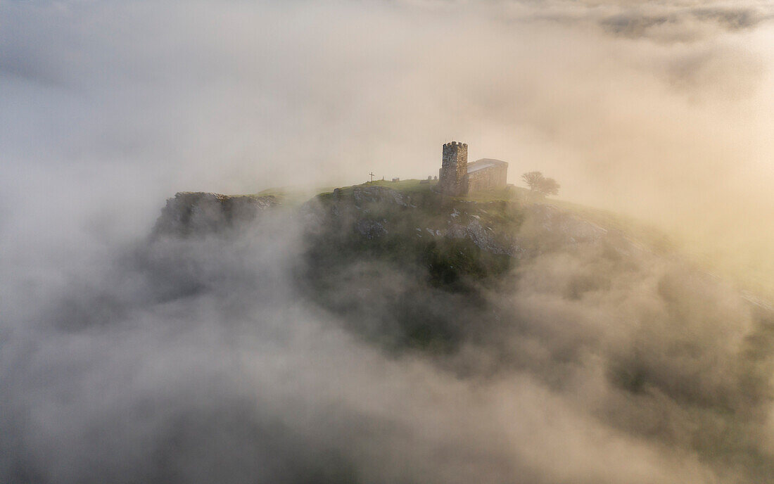 Brentor Church surrounded by morning mist in autumn, Dartmoor, Devon, England, United Kingdom, Europe