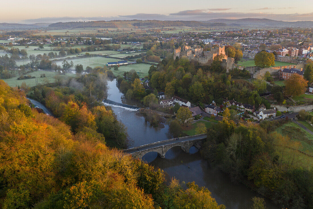 Aerial view of Ludlow Castle above the banks of the River Teme in autumn, Ludlow, Shropshire, England, United Kingdom, Europe