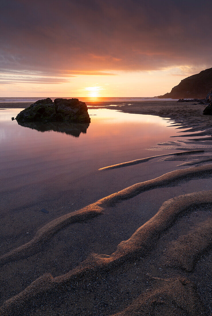 Beautiful sunset on a deserted Holywell Beach, Cornwall, England, United Kingdom, Europe