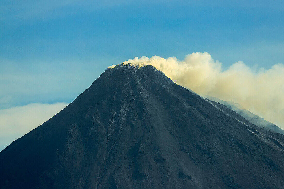 Sulphur smoke atop this active 1784m Pacific Ring of Fire volcano, Mount Karangetang, Siau, Sangihe Islands, Sulawesi, Indonesia, Southeast Asia, Asia