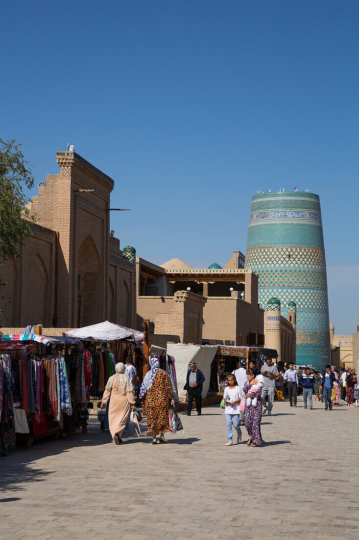 Shopping Street, Kalta Minaret in the background, Ichon Qala (Itchan Kala), UNESCO World Heritage Site, Khiva, Uzbekistan, Central Asia, Asia