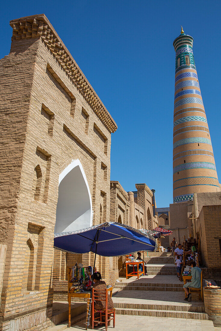 Shopping Street, Islam Khoja Minaret in the background, Ichon Qala (Itchan Kala), UNESCO World Heritage Site, Khiva, Uzbekistan, Central Asia, Asia