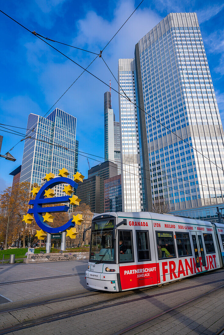 View of financial district skyline, city tram and the Euro Sculpture, Willy Brandt Platz, Frankfurt am Main, Hesse, Germany, Europe