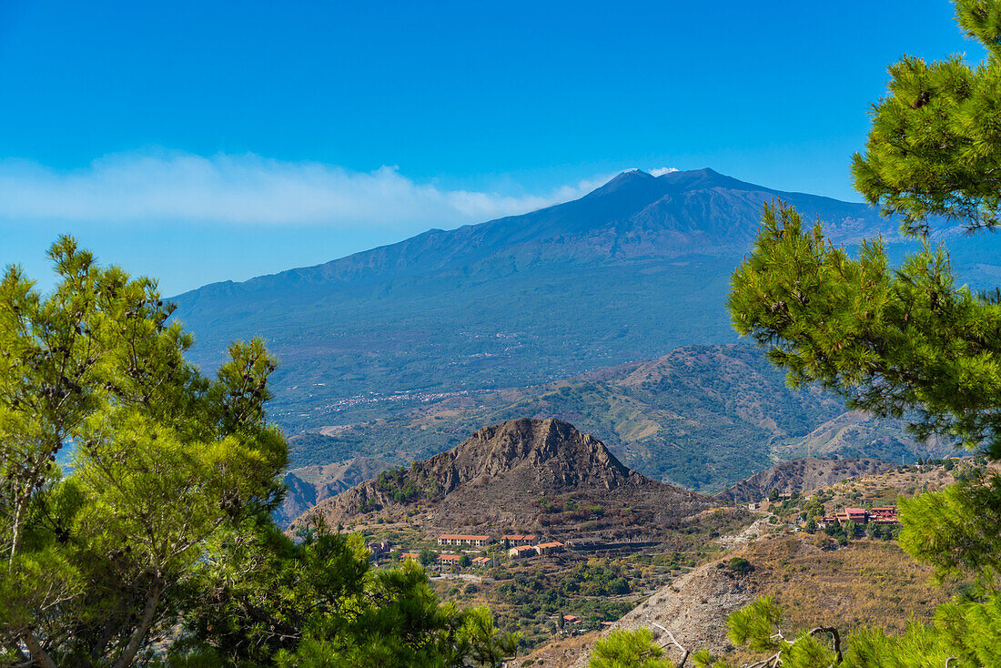 View of landscape with Mount Etna, UNESCO World Heritage Site, in background from Castelmola, Taormina, Sicily, Italy, Mediterranean, Europe