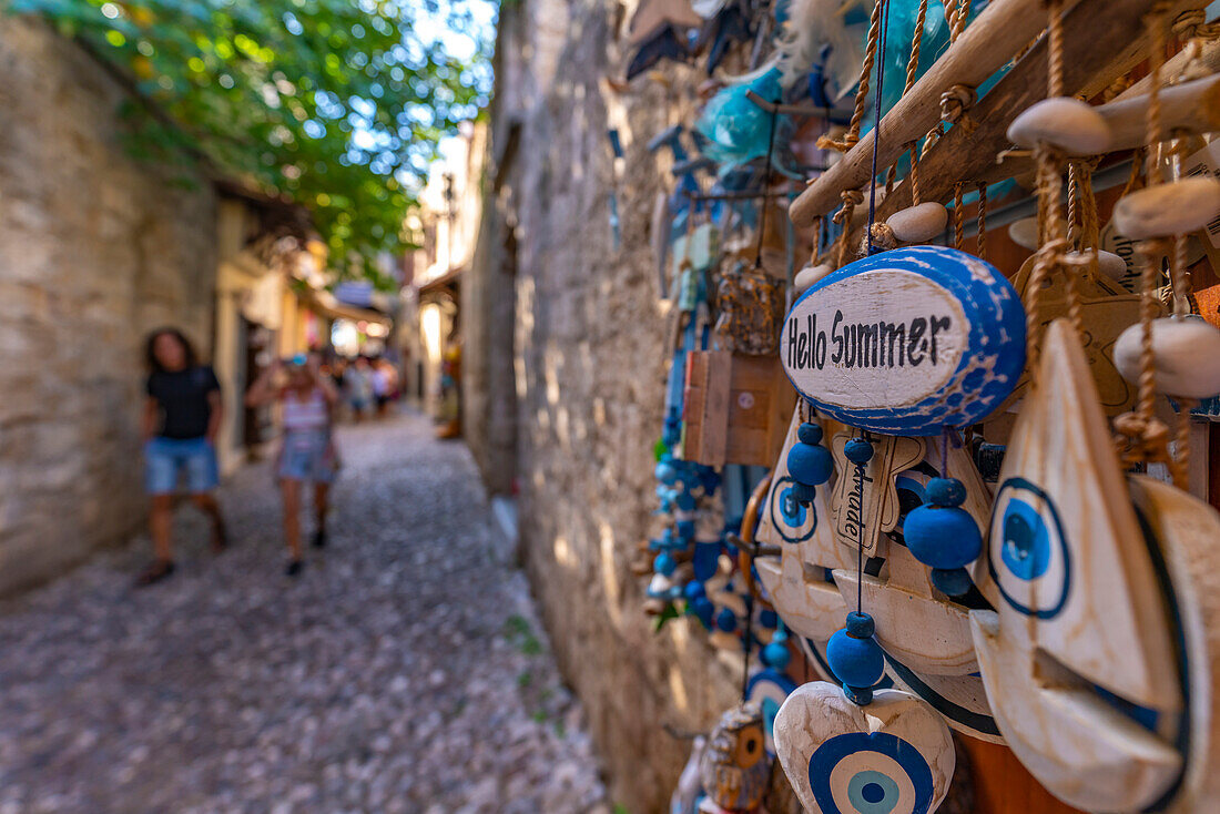View of souvenir shop in cobbled street, Old Rhodes Town, UNESCO World Heritage Site, Rhodes, Dodecanese, Greek Islands, Greece, Europe