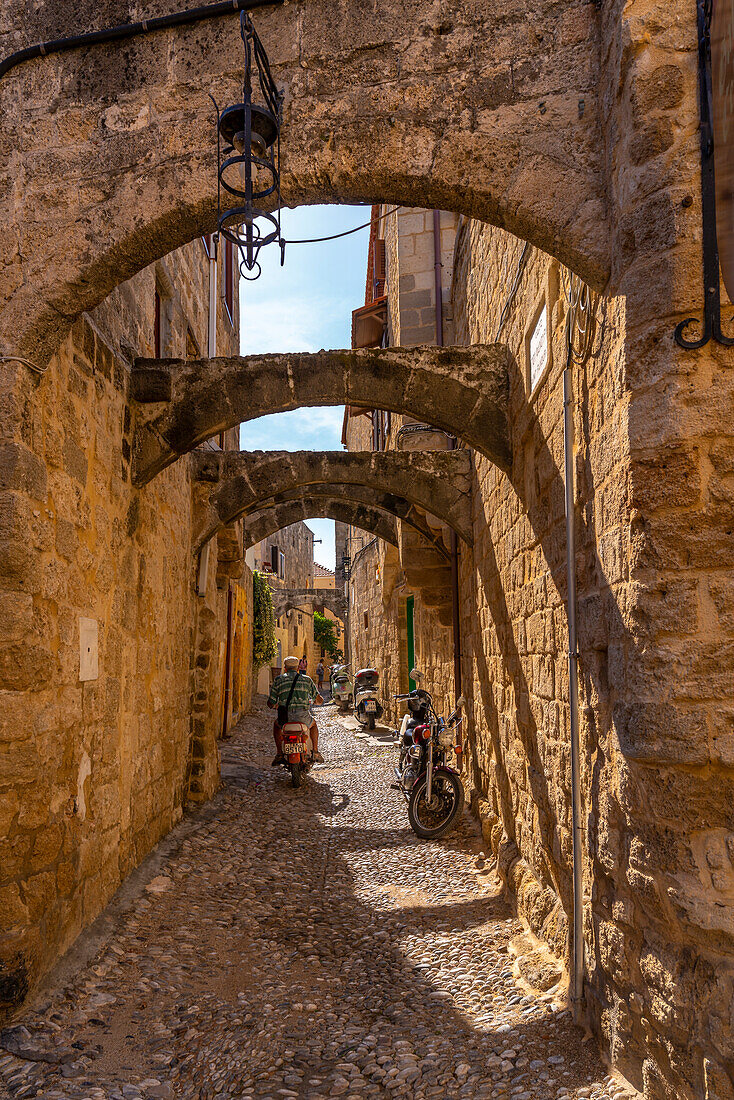 View of narrow cobbled street, Old Rhodes Town, UNESCO World Heritage Site, Rhodes, Dodecanese, Greek Islands, Greece, Europe