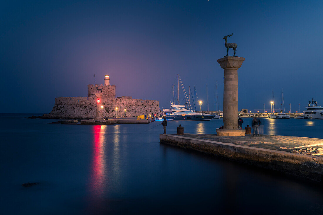 View of Saint Nicholas Fortress, Old Rhodes Town at dusk, UNESCO World Heritage Site, Rhodes, Dodecanese, Greek Islands, Greece, Europe