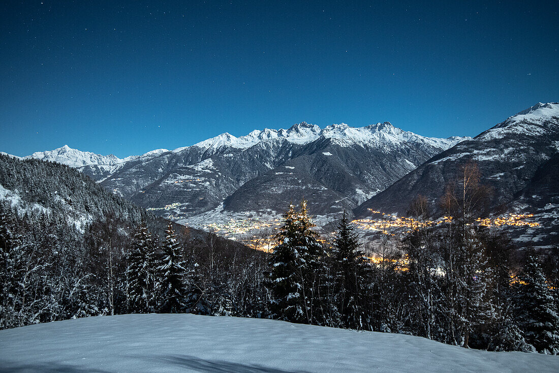 Disgrazia Mount and villages in a night with full moon, Piazzola alp, Castello dell'Acqua, Sondrio Province, Valtellina, Lombardy, Italy, Europe