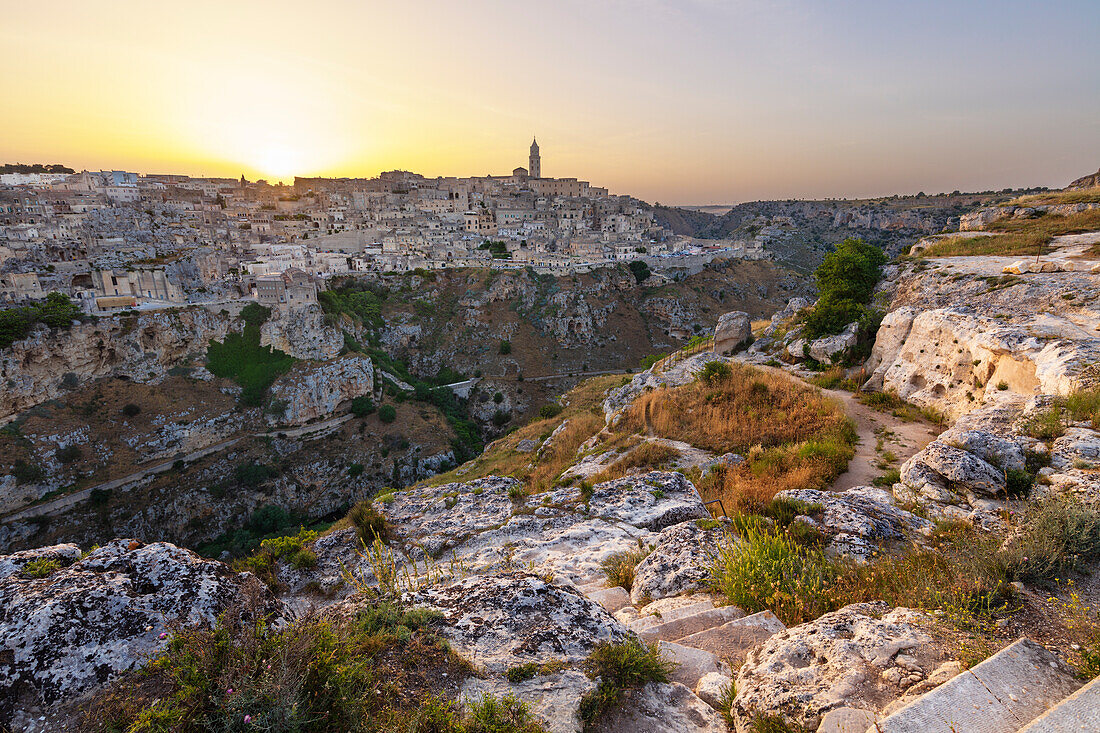 Sunset over Gravina River canyon to the Sassi di Matera old town, UNESCO World Heritage Site, Matera, Basilicata, Italy, Europe