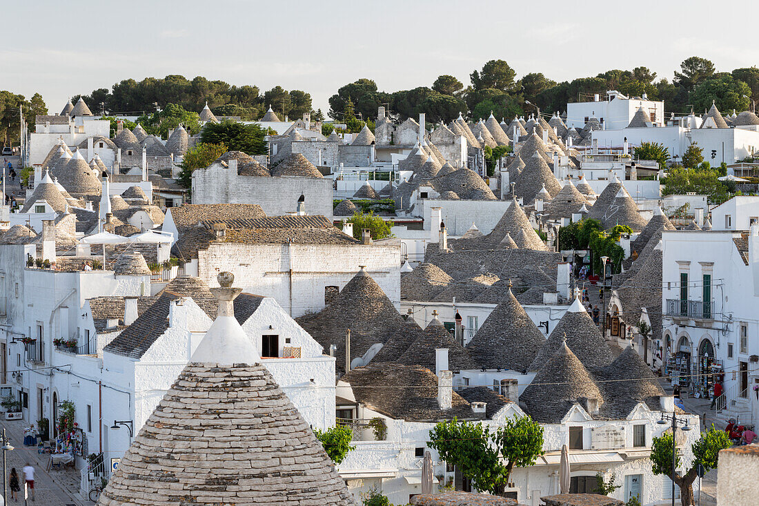 View over conical stone roofs of traditional trulli houses in the old town, Alberobello, UNESCO World Heritage Site, Puglia, Italy, Europe