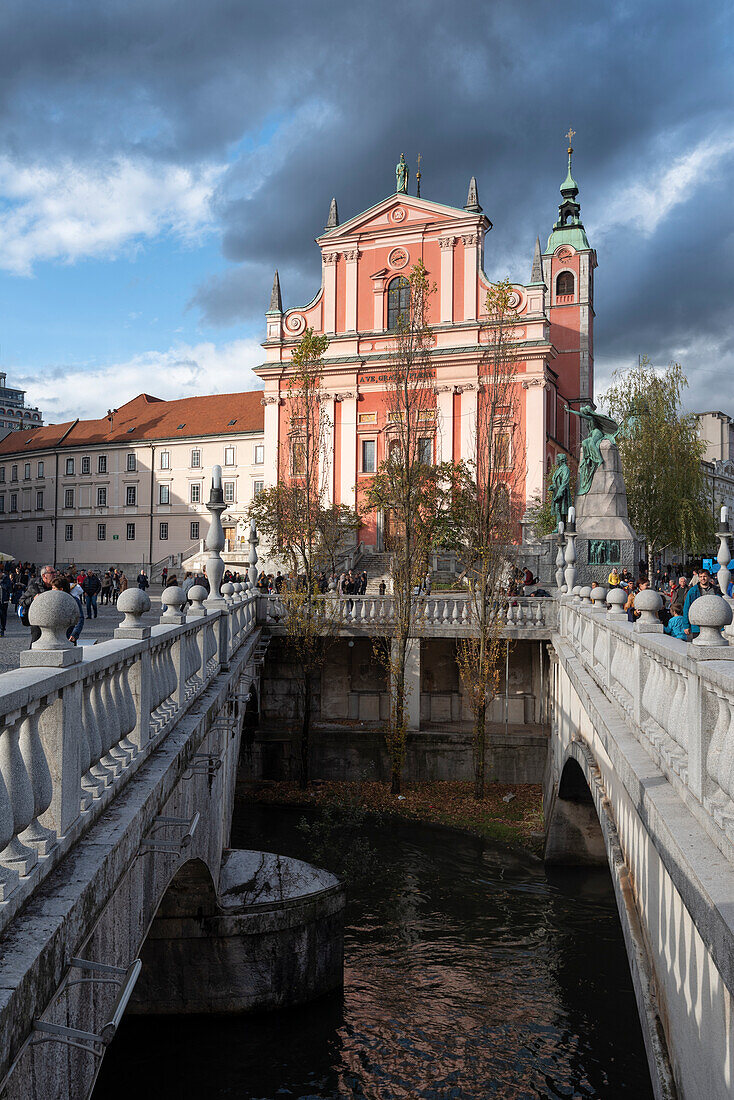 Tromostovje (Triple bridge) and Franciscan Church of the Annunciation in the center of Ljubiana, Slovenia, Europe