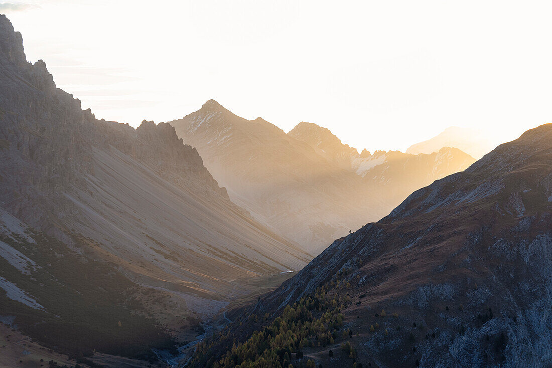 The first light from from Crap de La Pare in autumn, Valtellina, Sondrio province, Lombardy, Italy