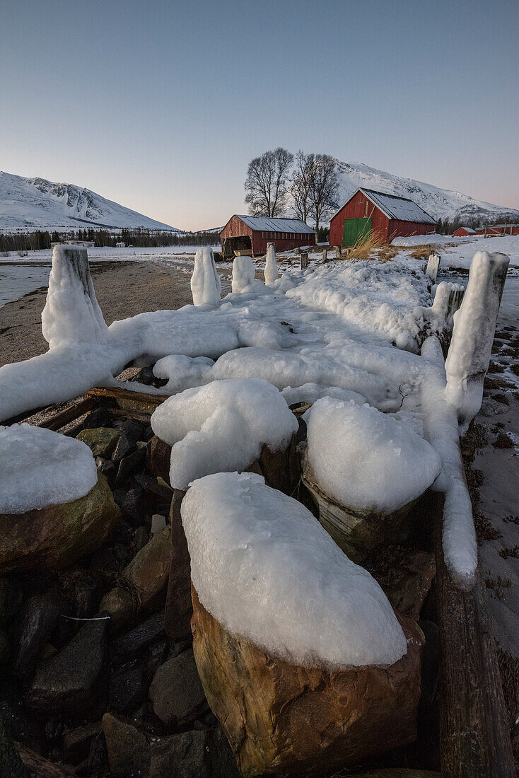 Typical fisherman houses in front of a fjord near Tromso,Troms county, Norway, Europe