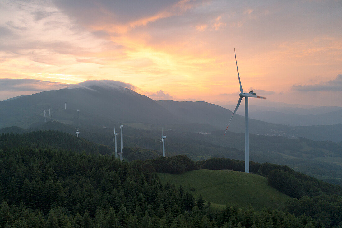 Aerial view of the Cappelletta Pass with wind turbine during a summer sunset, municipality of Albareto, Parma province, Emilia Romagna district, Italy, Europe