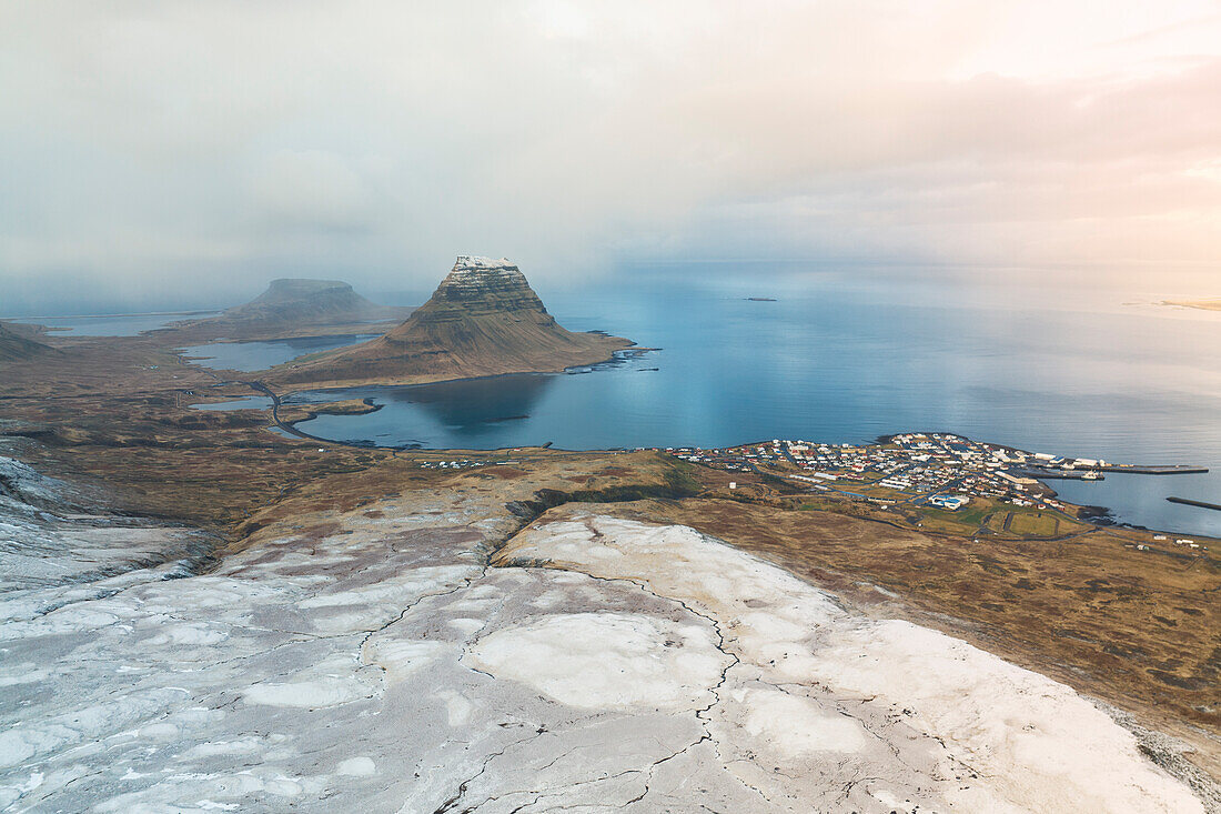 aerial view of Grundafjordur taken by drone during a winter snowfall, Snaefells Peninsula, Vesturland, Iceland, Europe