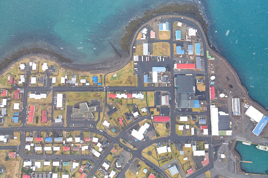 aerial vertical view of Grundafjordur taken by drone during a winter snowfall, Snaefells Peninsula, Vesturland, Iceland, Europe