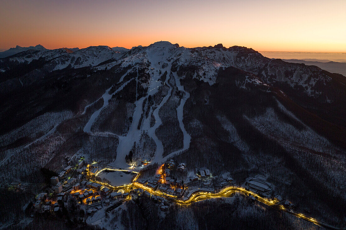 aerial view taken by drone of Cerreto Laghi during a winter sunset, Tuscan-Emilian National Park, municipality of Ventasso, Reggio Emilia province, Emilia-Romagna district, Italy, Europe