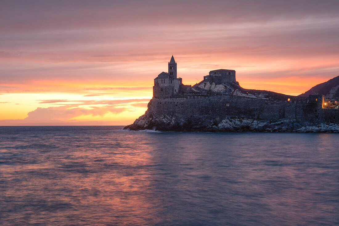 a long exposure to capture the warm sunset at iconic San Pietro Church, municipality of Portovenere, La spezia province, Liguria district, Italy, Europe