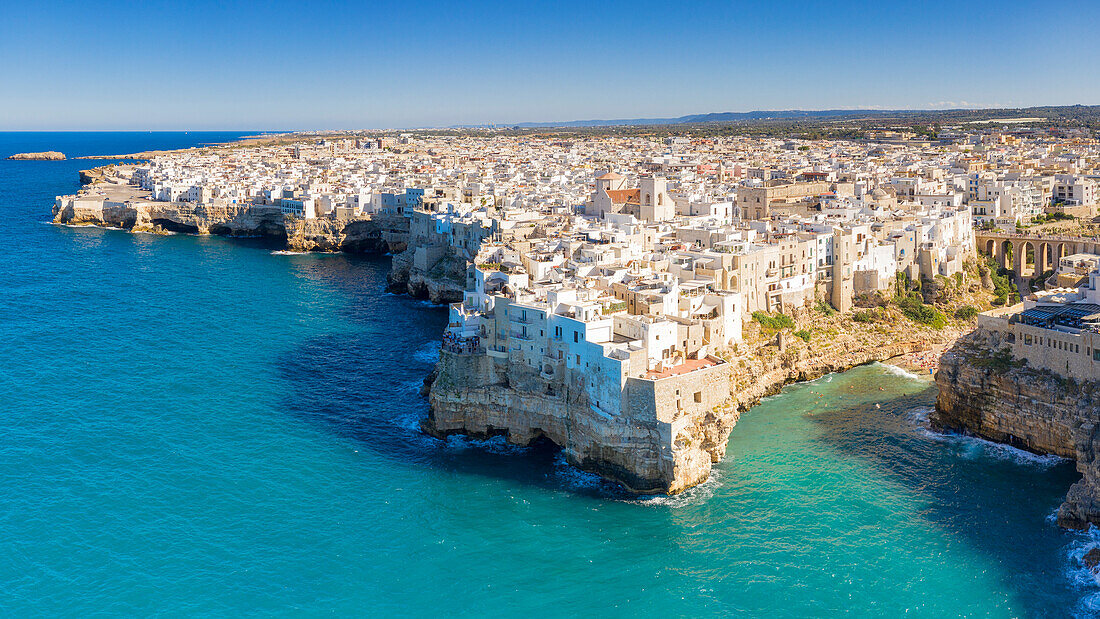 aerial view taken by drone of the splendid seaside village of Polignano a Mare, during a splendid summer day, municipality of Polignano a Mare, Bari province, Apulia district, Italy, Europe