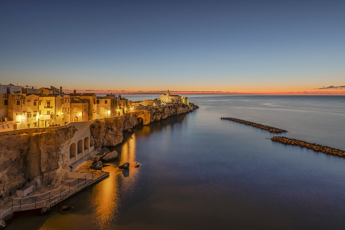 view of the historic center of Vieste, taken during a blue hour in summer time, municipality of Vieste, Foggia province, Apulia district, Italy, Europe