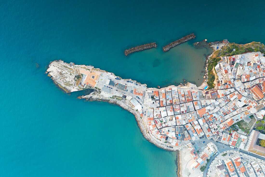 vertical aerial view of the historic center of Vieste, taken during a summer sunrise, municipality of Vieste, Foggia province, Apulia district, Italy, Europe