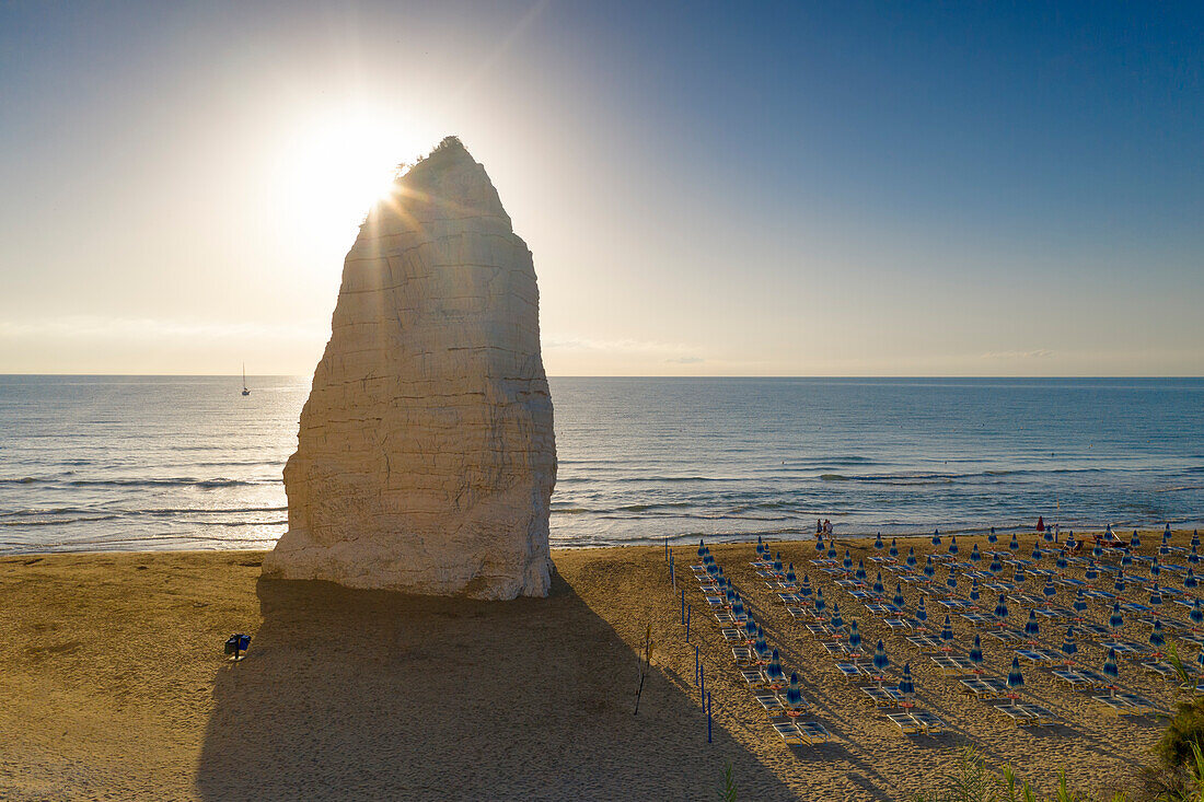 aerial view of the Pizzomunno rock in the equipped beach of Vieste, taken during a summer sunrise, municipality of Vieste, Foggia province, Apulia district, Italy, Europe