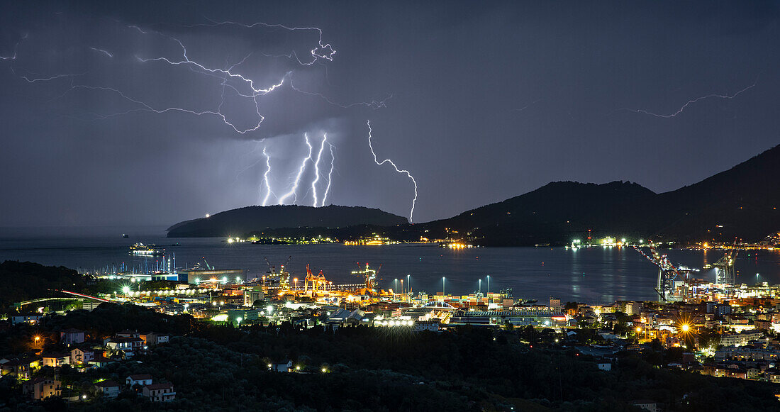 a lightning storm envelops the Gulf of Poets during an autumn evening, municipality of La Spezia, La Spezia province, Liguria district, Italy, Europe