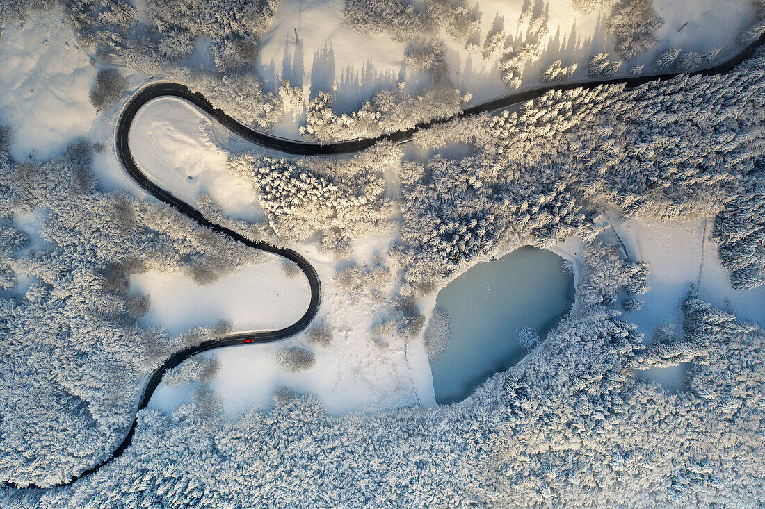 the sinuous curves of the Apennine roads, taken by the drone during an winter day, Tuscan-Emilian apennine national park, municipality of Ventasso, Reggio Emilia province, Emilia Romagna district, Italy, Europe