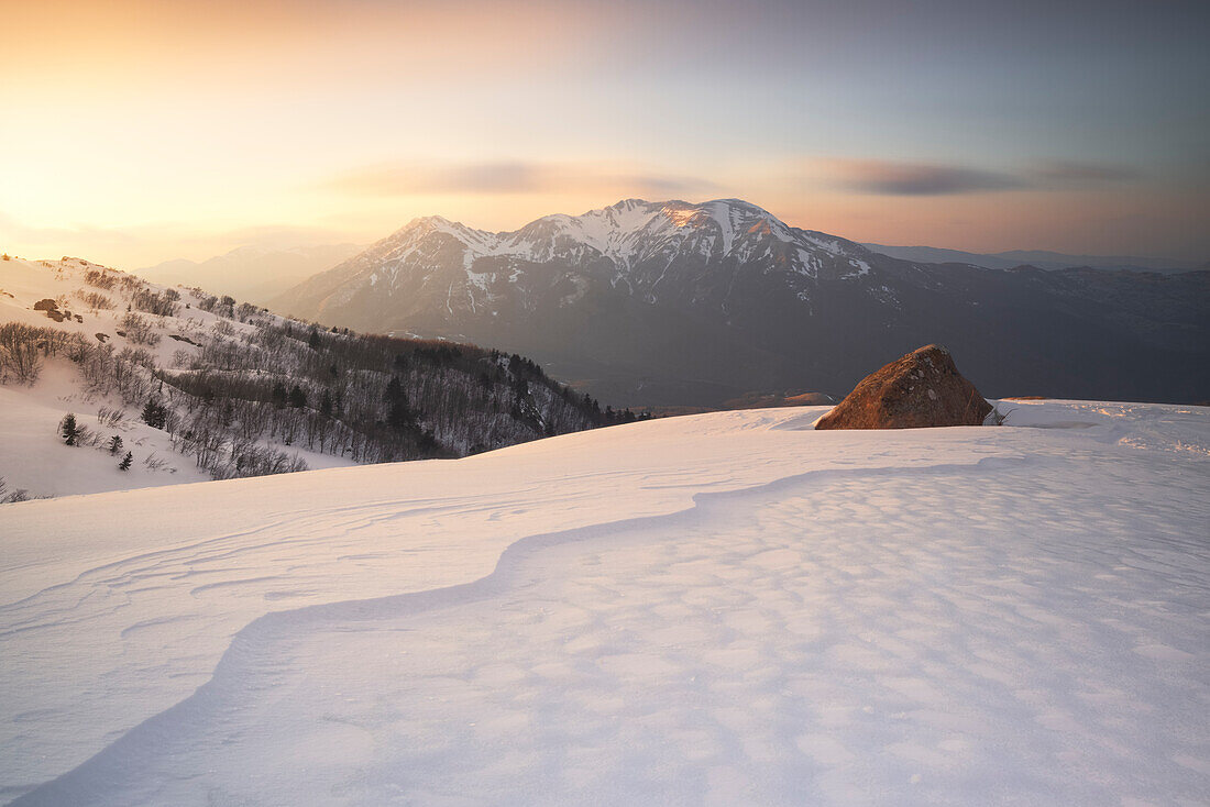 the warm light of sunset illuminates the peaks of the Apennines, Tuscan-Emilian National Park, municipality of Ventasso, Reggio Emilia province, Italy, Europe