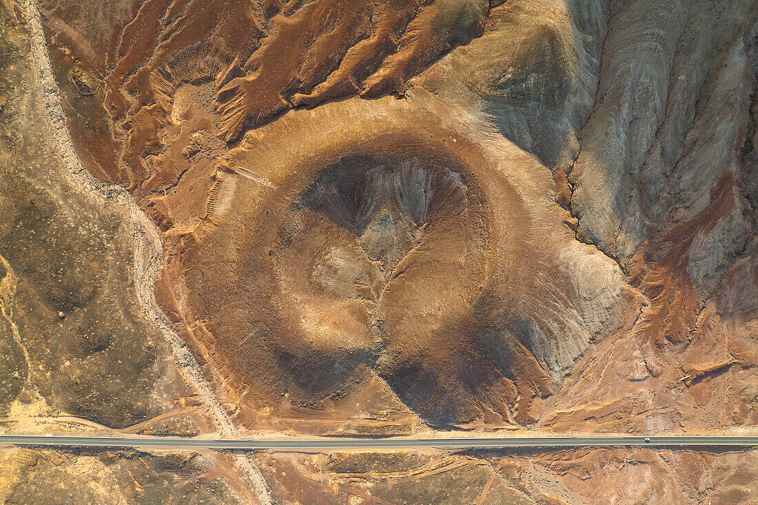 aerial vertical view taken by drone of the Montaña Roja volcano, during a summer day, Natural Park of Corralejo, Fuerteventura, Canary Island, Spain, Europe