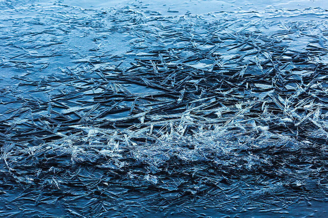 Ice cracks at Passo Coe lake, Trentino, Italy