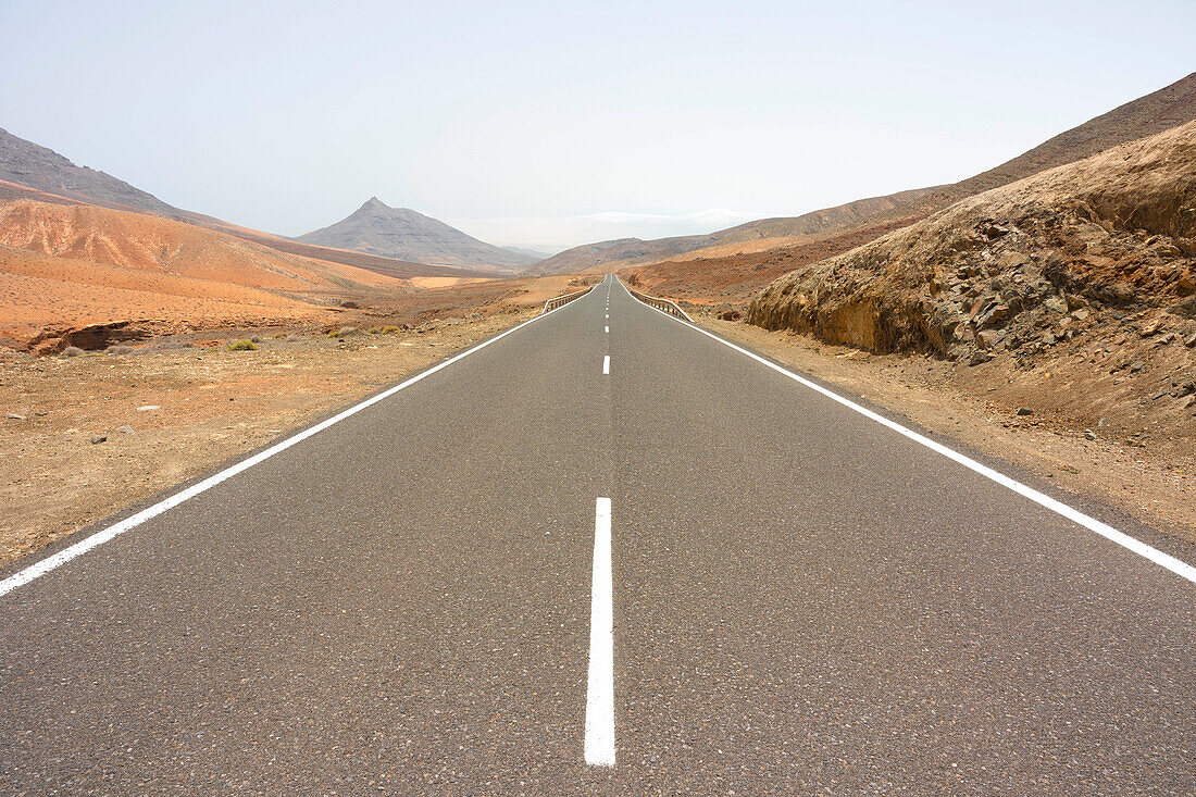 the asphalt road to Mirador astronomico de Sicasumbre during a summer day, Sicasumbre, Fuerteventura, Canary Island, Spain, Europe