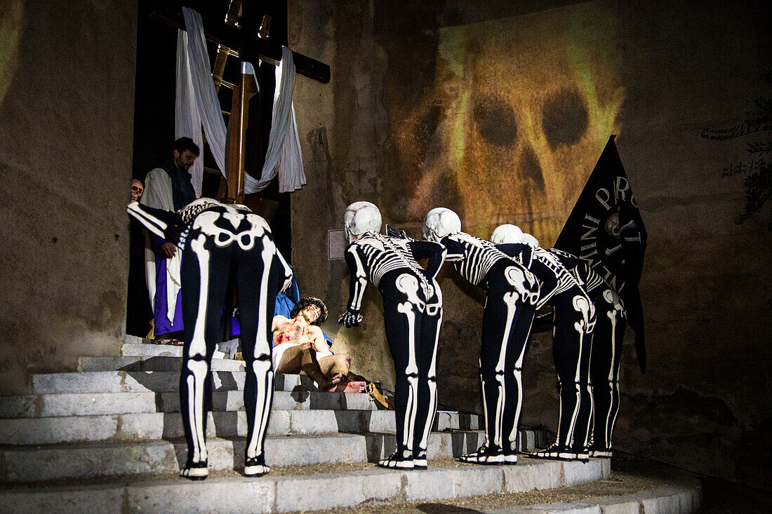 Verges, a small town in the Northeast of Catalonia (Spain), during Easter celebrates the Procession of Verges with skeletons dancing on the sound of a drum, Roman soldiers, known as the 'Manages', and a representation of the life and crucifixion of Jesus Christ. The Procession features the Dance of Death, a tradition from the Middle Age associated with epidemics and plagues and the only one remaining in Spain. Ten skeletons dance to the beat of a drum to remember that no one is exempt of death. The backdrop of the medieval walls and towers of Verges is key to this macabre staging.