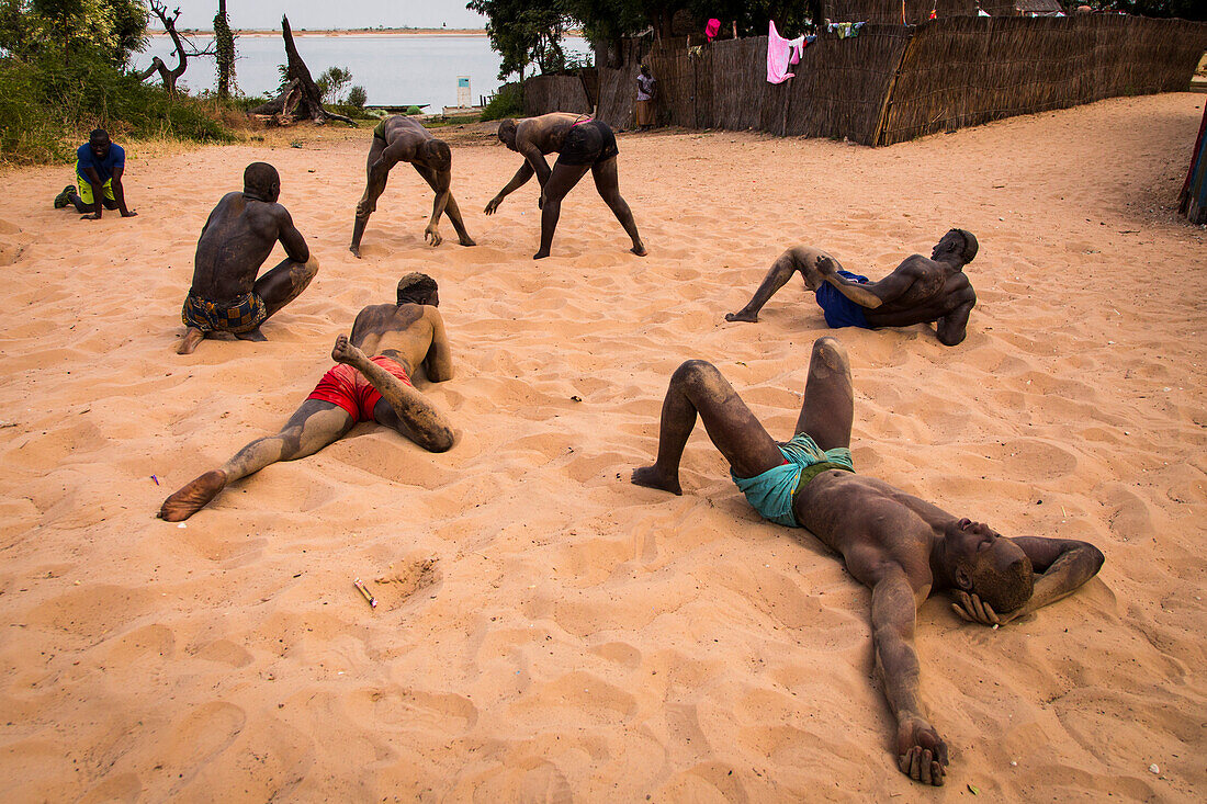 Wrestlers play Senegalese wrestling in Simal