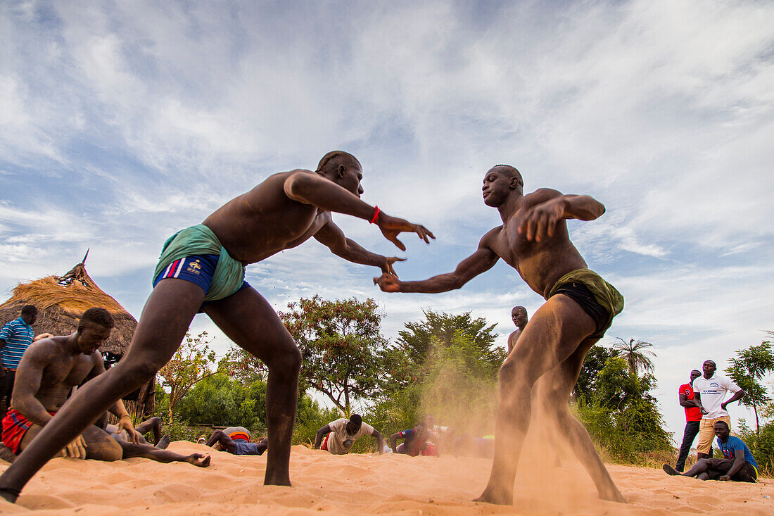 Wrestlers play Senegalese wrestling in Simal