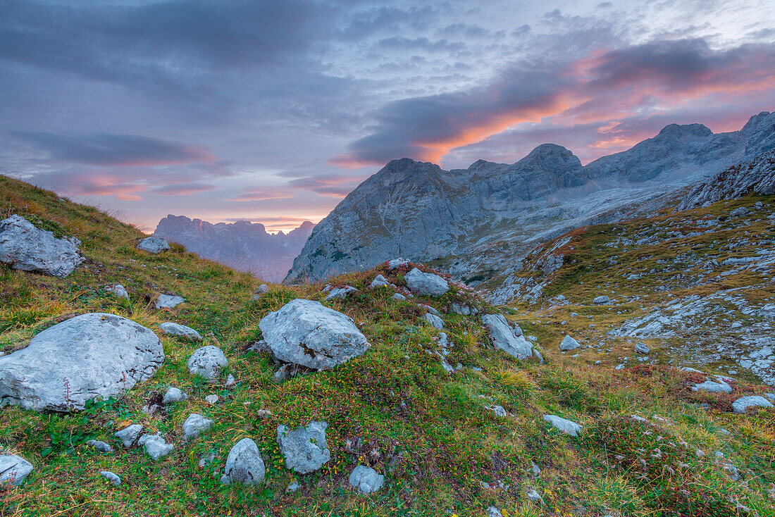 Sunrise over rocky mountain peaks and boulders at the Marmarole mountain range, Tiziano alpine hut. Belluno, Veneto, Italy.