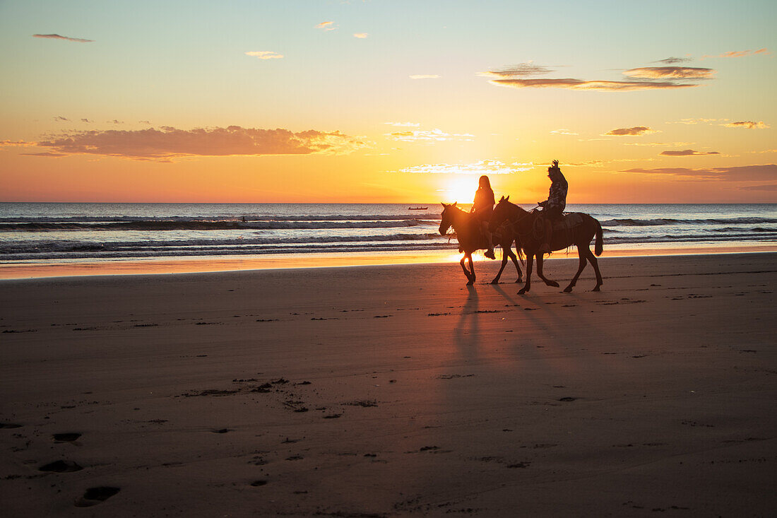 Horse riding at sunset in Jiquilillo beach, Chinandega, Nicaragua