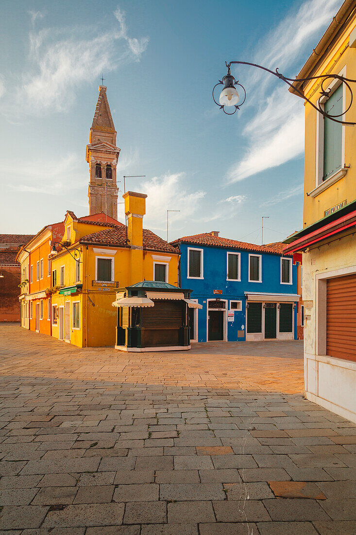 The iconic leaning bell-tower of Burano at dawn, Venice, Veneto, Italy, Europe