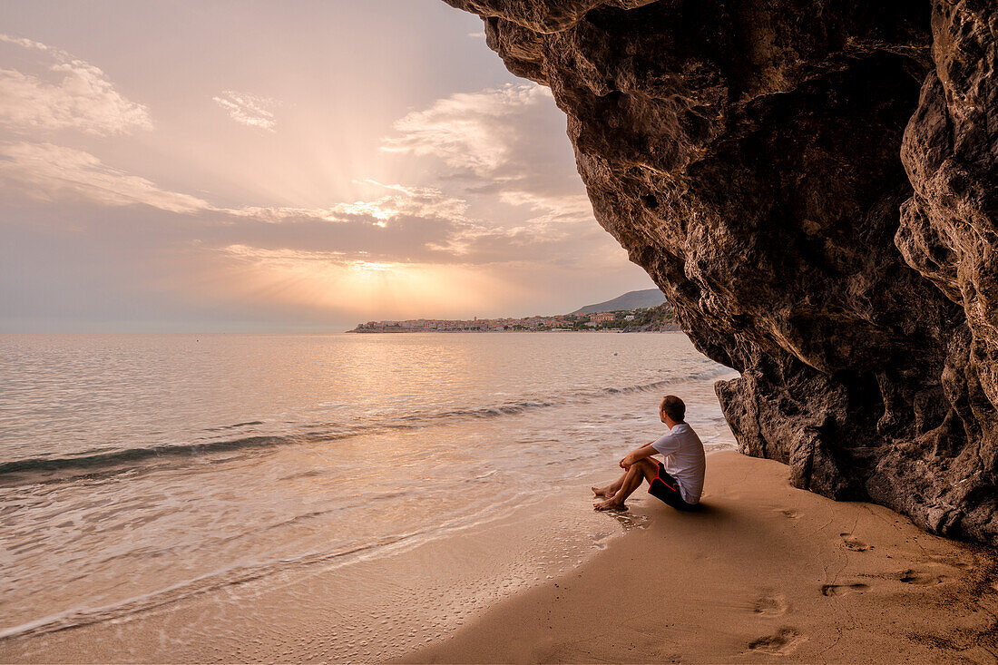 A man enjoying the Beach of Lentiscelle at dusk, Marina di Camerota, Salerno province, Campania region, Italy, Europe