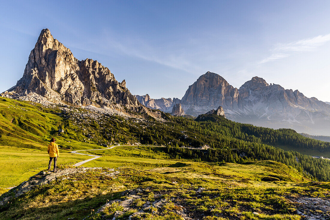 Italy, Veneto, province of Belluno, hiker admires mount La Gusela and Tofane group at Giau pass (MR)