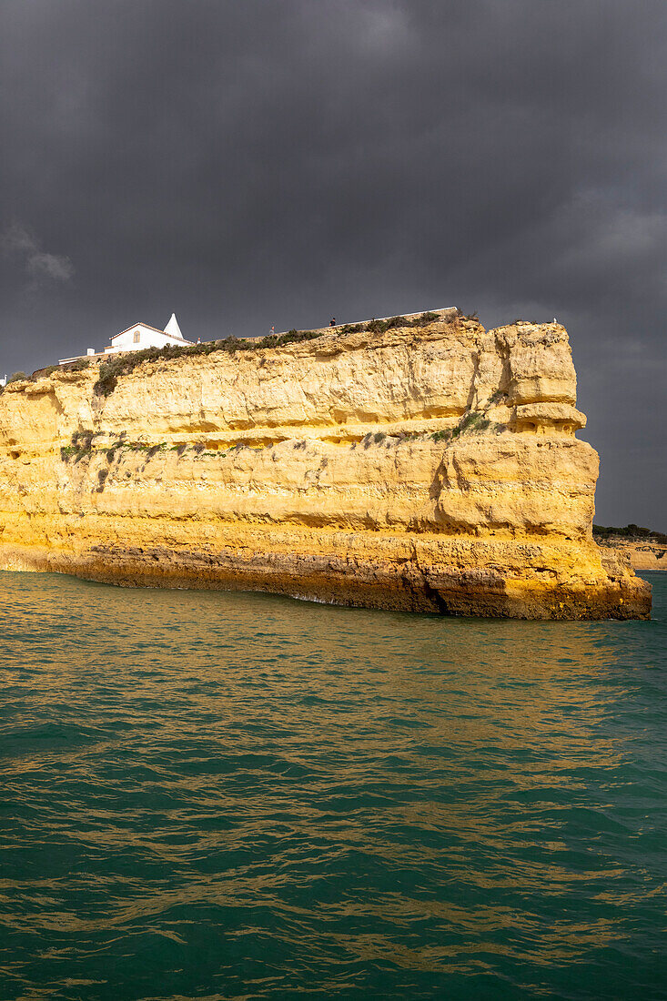 View from the sea of De Nossa Senhora da Rocha Church, Alporchinhos village, Faro district, Algarve, Portugal