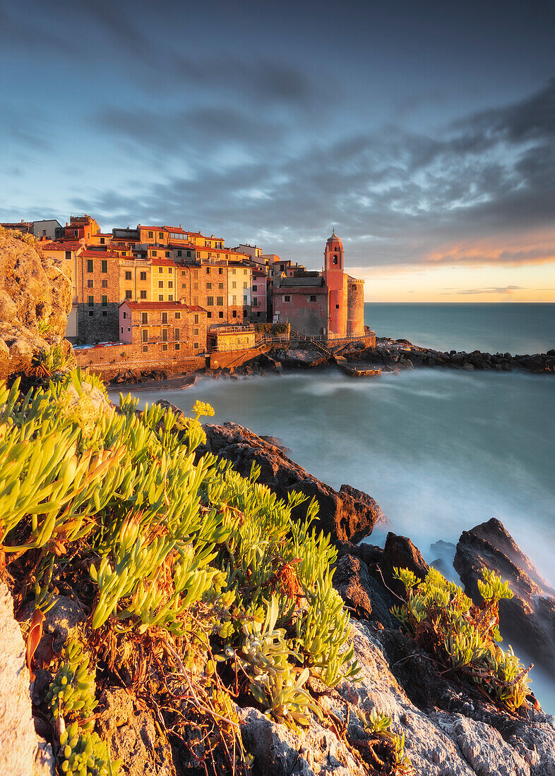 Long exposure during an intense sunset over the village of Tellaro, municipality of Lerici, La Spezia province, Liguria district, Italy, Europe