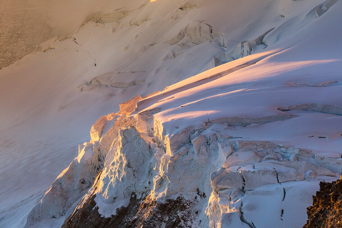 A close up of Serac in the high part of Riedglacier at sunrise from Nadelgrat. Zermatt valley, Canton Vallese, Alps, Switzerland.