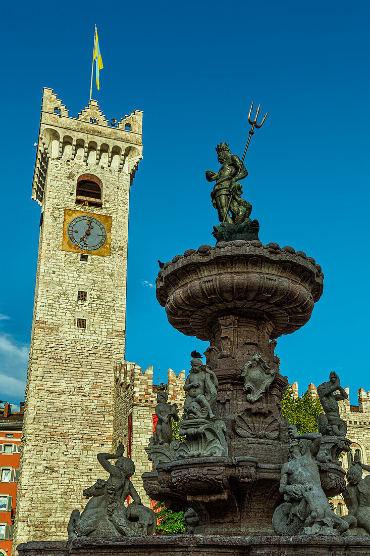 The Triton fountain and the clock tower in Piazza Duomo in Trento. Trento, autonomous province of Trento, Trentino-Alto Adige, Italy, Europe