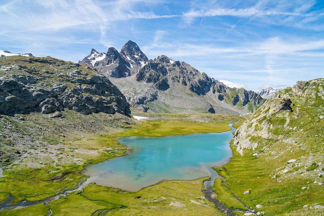 The Deffeyes lake and the Grand Assaly in the background. Deffeyes refuge, La Thuile, Aosta Valley, Italy, Alps, Europe.
