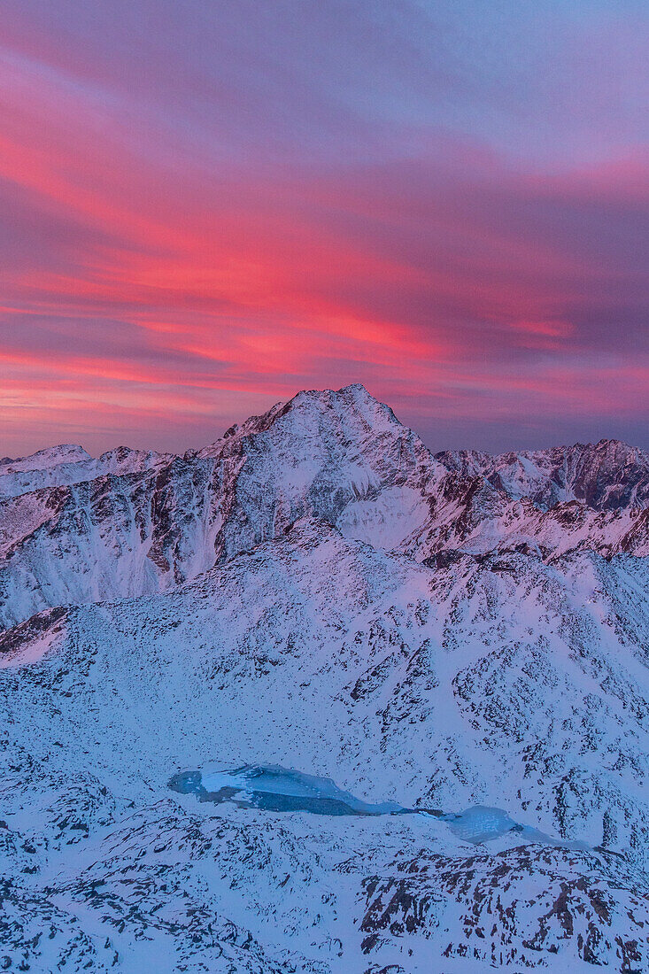 Winter landscape at sunset from high mountains of Valfurva. Vallombrina peak, Gavia pass, Valfurva, Sondrio district, Lombardy, Italy Alps, Europe;