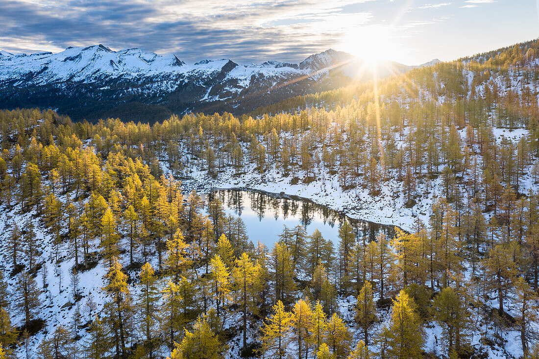 Aerial view of the Nero Lake in autumn at sunrise (Buscagna Valley, Alpe Devero, Alpe Veglia and Alpe Devero Natural Park, Baceno, Verbano Cusio Ossola province, Piedmont, Italy, Europe)