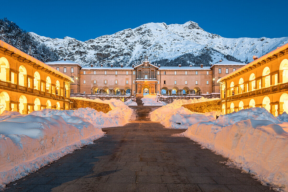 Entering in the Marian Sanctuary of Oropa after an heavy snowfall at morning twilight (Biella, Biella province, Piedmont, Italy, Europe)