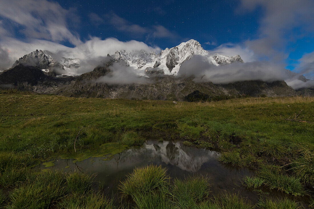 The Grandes Jorasses during a full moon night (Alp Lechey, Ferret Valley, Courmayeur, Aosta province, Aosta Valley, Italy, Europe)