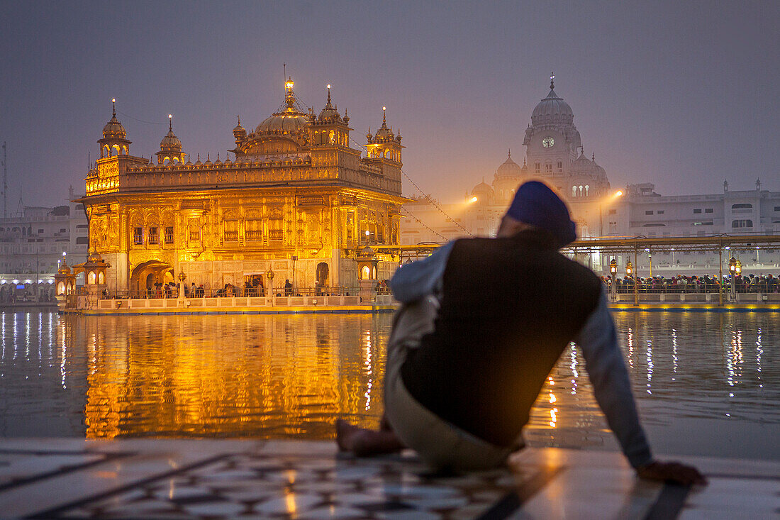 pilgrim and sacred pool Amrit Sarovar, Golden temple, Amritsar, Punjab, India